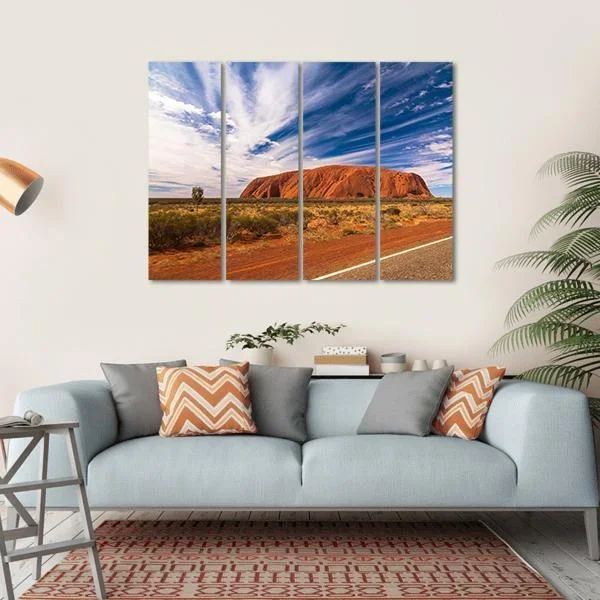 White Clouds Over Ayers Rock In Australia Canvas Wall Art